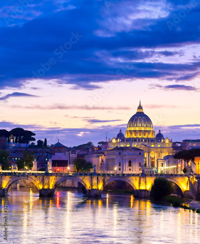 A view along the Tiber River towards Vatican City in Rome, Italy. © Jbyard