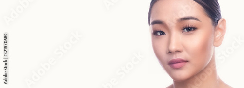 Beautiful Young Asian Woman with Clean Fresh Skin isolate on white background. Spa, Face care, Facial treatment, Beauty and Cosmetics concept. Leaning right. Banner frame.