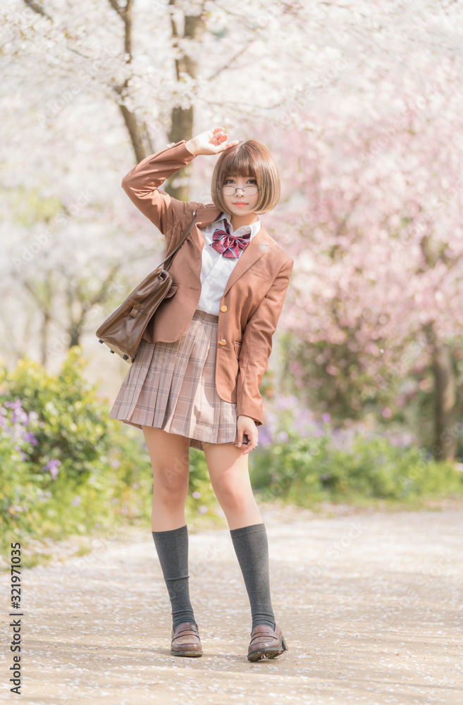 A girl in a spring cherry garden A girl in a spring cherry garden