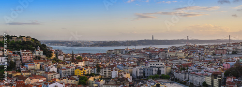 Lisbon Portugal aerial view sunset panorama city skyline at Lisbon Baixa district and Saint George Castle