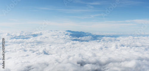 Aerial view over clouds, Blue sky with white cloud in the morning