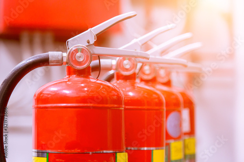 Red tank of fire extinguisher Overview of a powerful industrial fire extinguishing system.