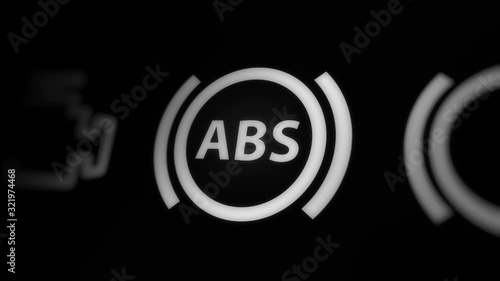 Anti-lock Braking System (ABS) Warning Light on Car Dashboard photo