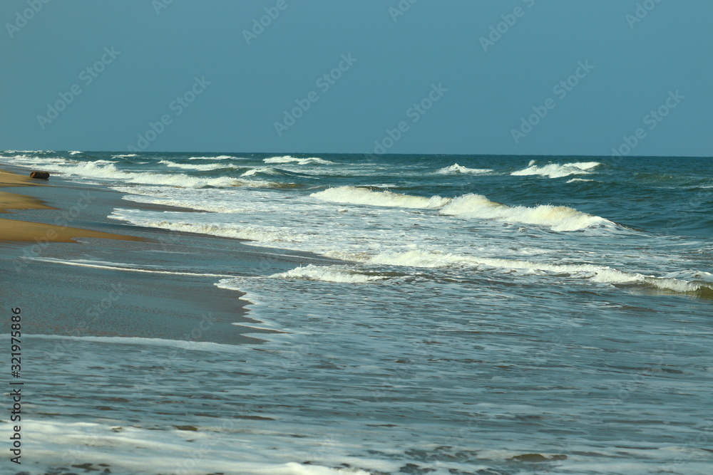 brilliant coastline on blue beach against blue sharp sky brilliant coastline on blue beach against blue sharp sky