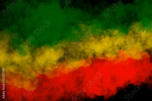 Green yellow red smoke on black background ,reggae background concept