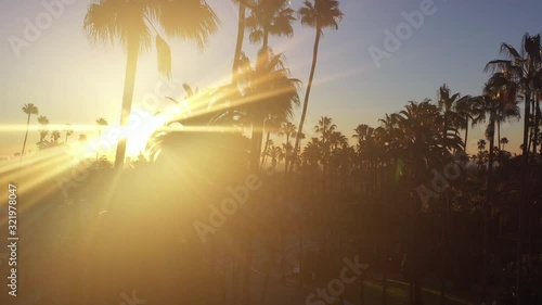 Stunning aerial view of Beverly Hills neighborhood, Beverly Hills Hotel, and Sunset Boulevard surrounded with palm trees in Los Angeles, California.