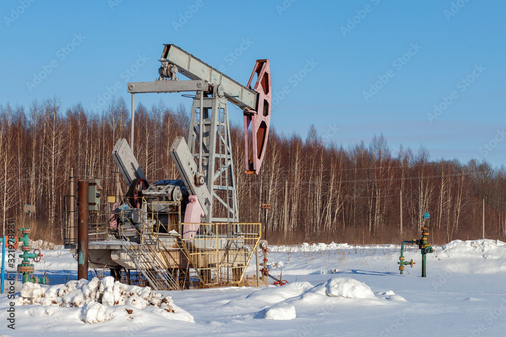 Oil pump in winter. Oil production in the North Oil pump in winter. Oil production in the North