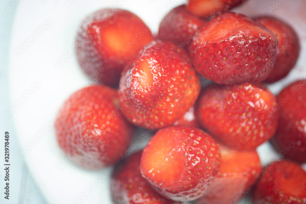 Fresh strawberries on a white plate Fresh strawberries on a white plate