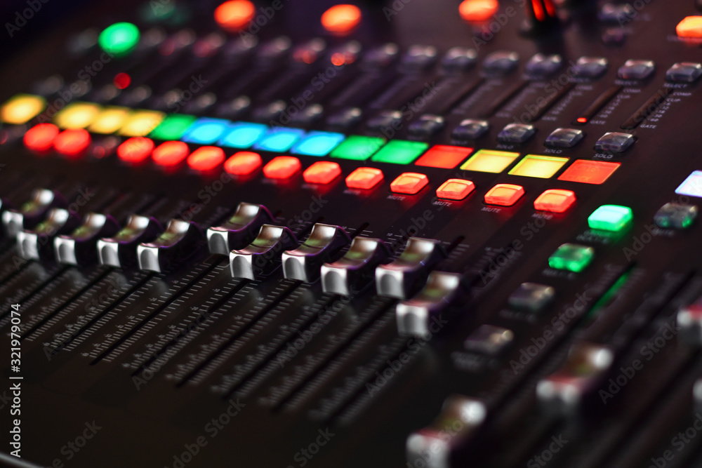 Buttons of professsional music audio sound mixer. Low DOF, selective focus.
