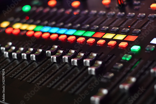 Buttons of professsional music audio sound mixer. Low DOF, selective focus.