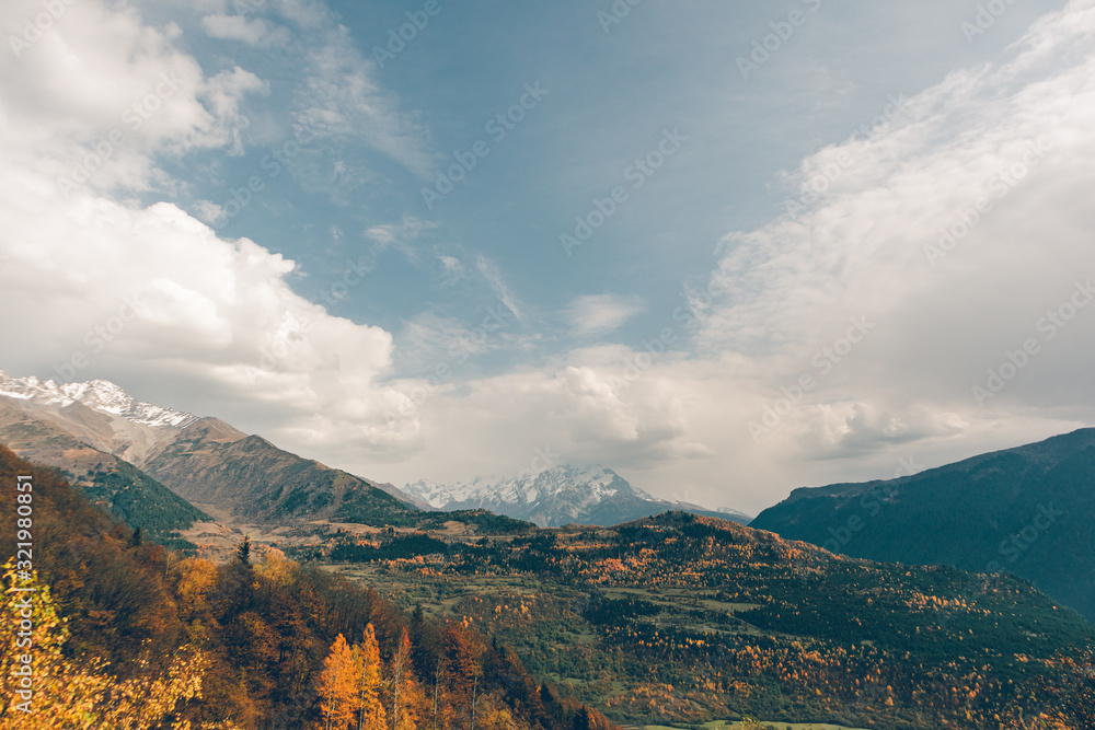 Naklejka premium Beautiful autumn mountain landscape photo with yellow and orange color in fall season.