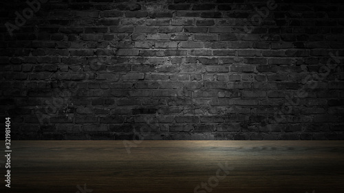 background of an empty black room  a cellar  lit by a searchlight. Brick black wall and wooden floor