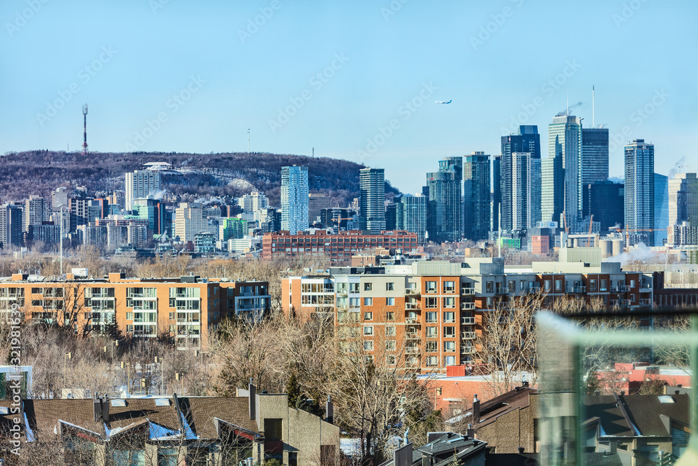 Montreal downtown skyline in winter with Mt Royal mount. Quebec Canada city travel.