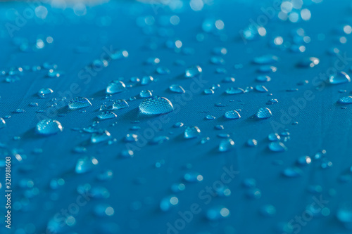  Water droplets on a  waterproof fabric blue background