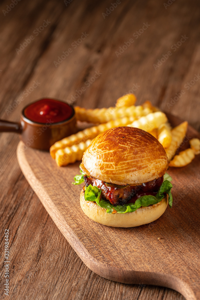 Fresh home-made hamburger served on wood