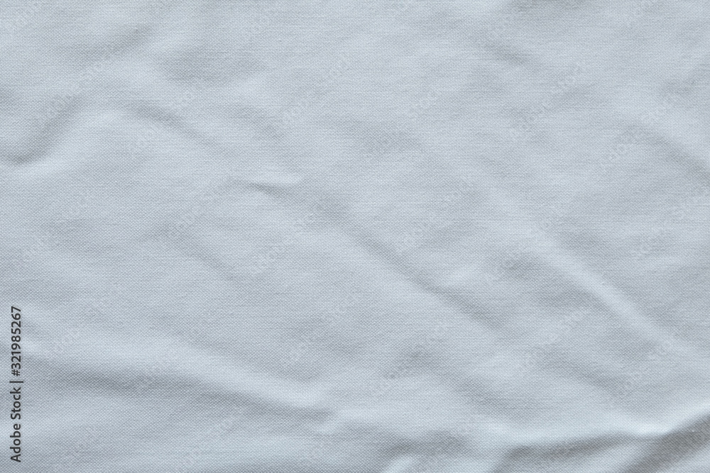 Wrinkled White fabric close up shot of good quality Cotton and polyester shirt. formal wear for office worker . Background texture concept with copy space for text.