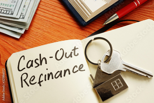Cash out refinance and key on the notepad. photo