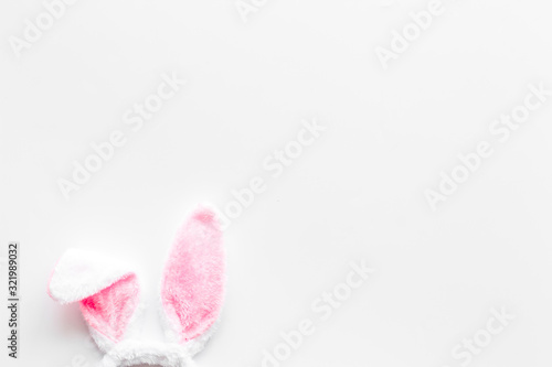 Foto Easter bunny's ears on white background top-down copy space