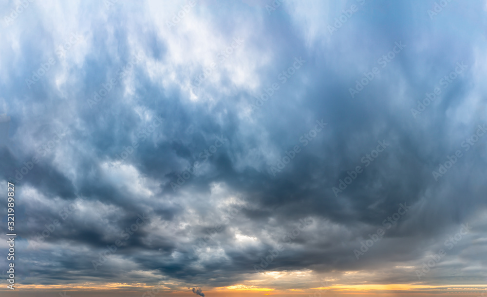 Obraz premium Fantastic dark thunderclouds at sunrise