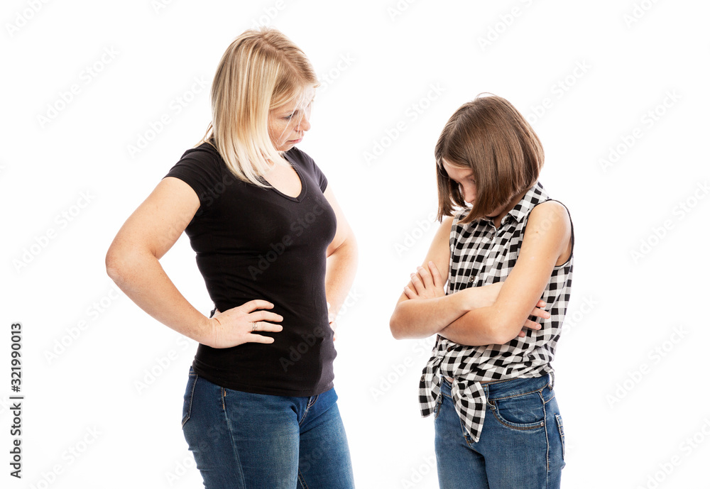 A young woman scolds the daughter of a teenager. The conflict of generations. White background. A young woman scolds the daughter of a teenager. The conflict of generations. White background.