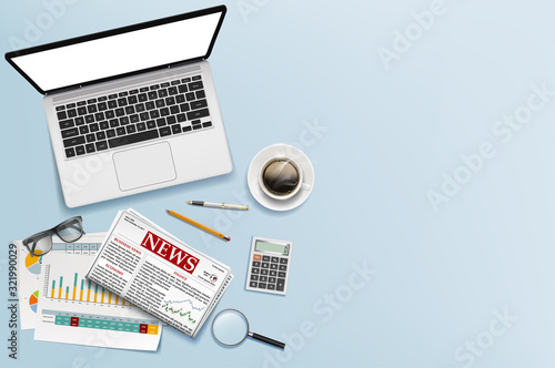 Workplace office table with laptop, documents and stationery.