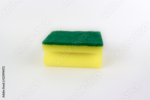 Yellow green sponge isolated on white background