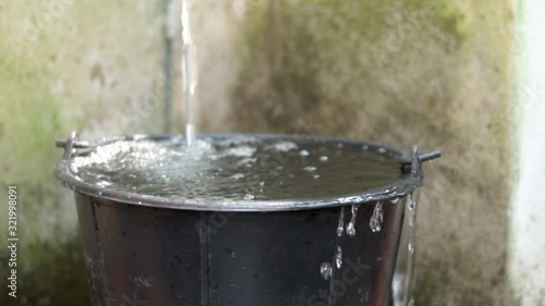 The water is opened to flow into the water tank until overflowing.