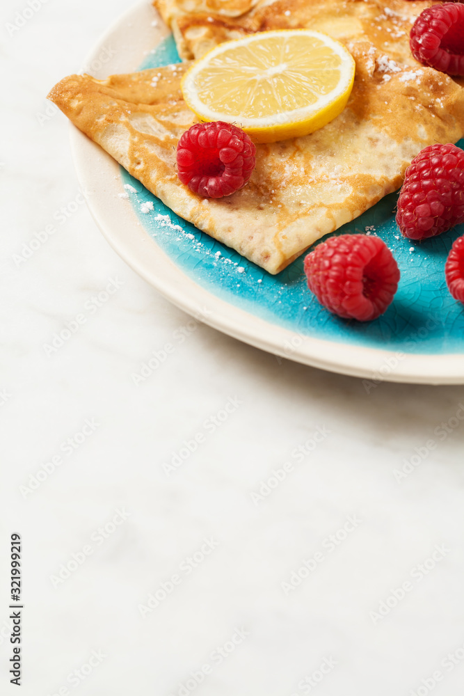 Folded pancakes on white marble background Folded pancakes on white marble background