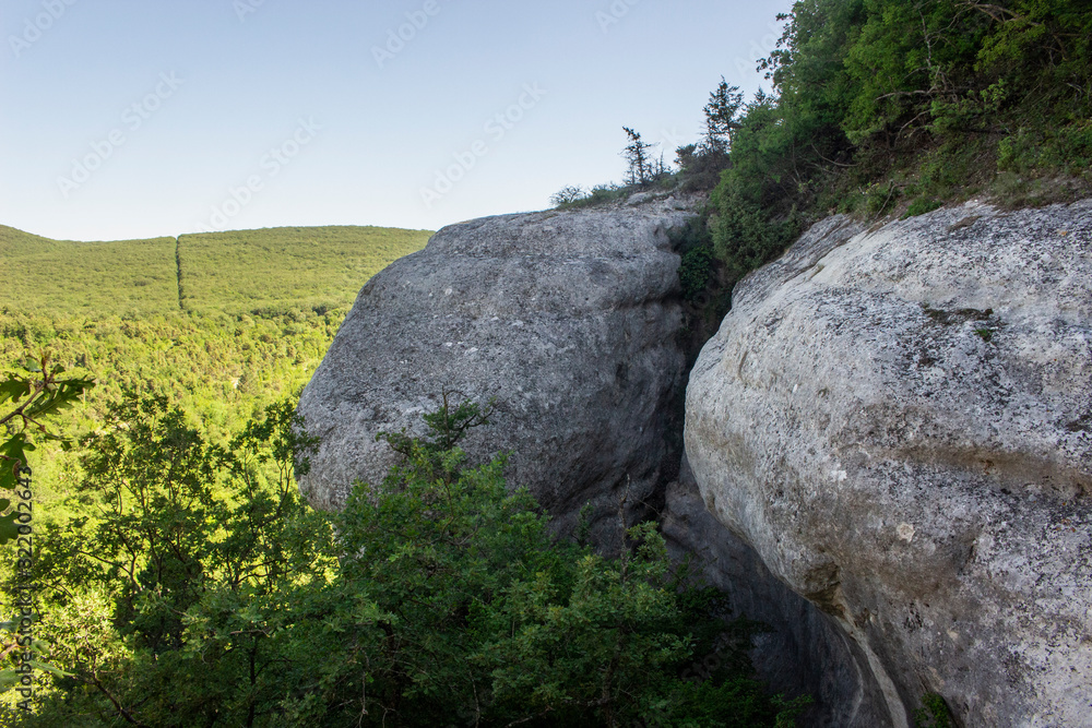 Rocky formations. Rocky terrain. Limestone skaa. Ancient gorge in the mountains. Natural landscape in a southern country. A tourist place to stay.