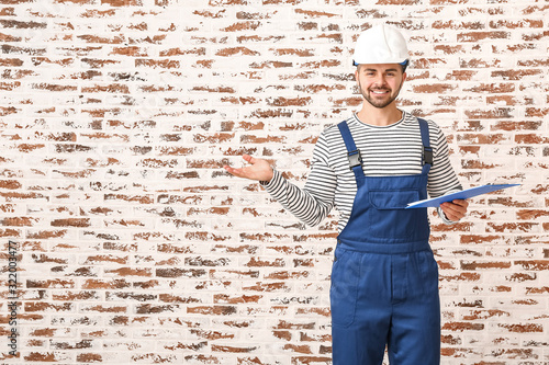 Handsome male worker with c...