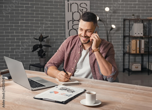 Handsome businessman workin...