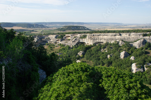 Rocky formations. Rocky terrain. Limestone skaa. Ancient gorge in the mountains. Natural landscape in a southern country. A tourist place to stay. photo