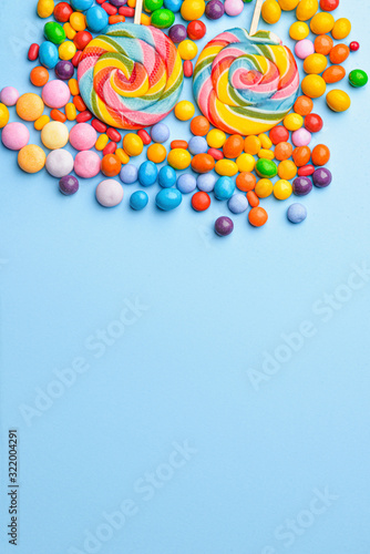 Tasty candies on color background © Pixel-Shot