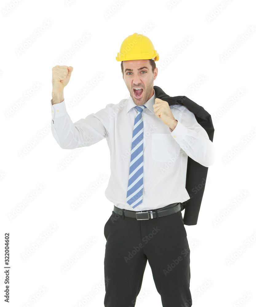 Standing smart engineer in white shirt wearing yellow helmet showing fist and shouting isolated on white background Standing smart engineer in white shirt wearing yellow helmet showing fist and shouting isolated on white background