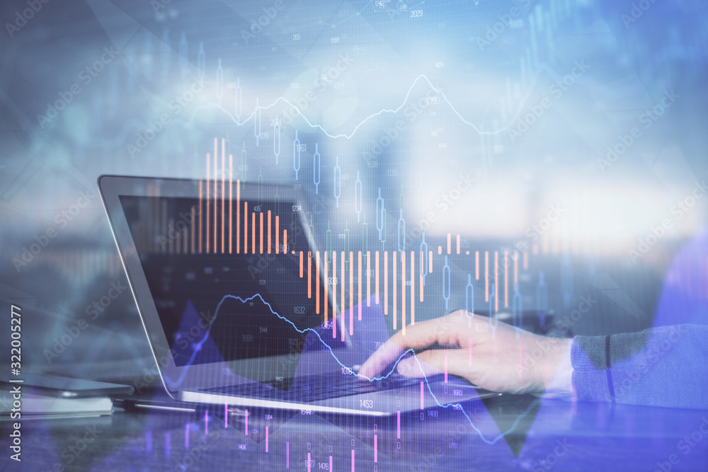 Double exposure of stock market graph with man working on laptop on background. Concept of financial analysis. Double exposure of stock market graph with man working on laptop on background. Concept of financial analysis.