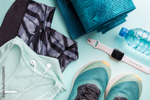 Healthy lifestyle, sport or athlete's equipment set on bright background. Flat lay. Top view with copy space.