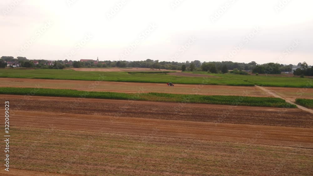 and tractor by work at late summer and tractor by work at late summer