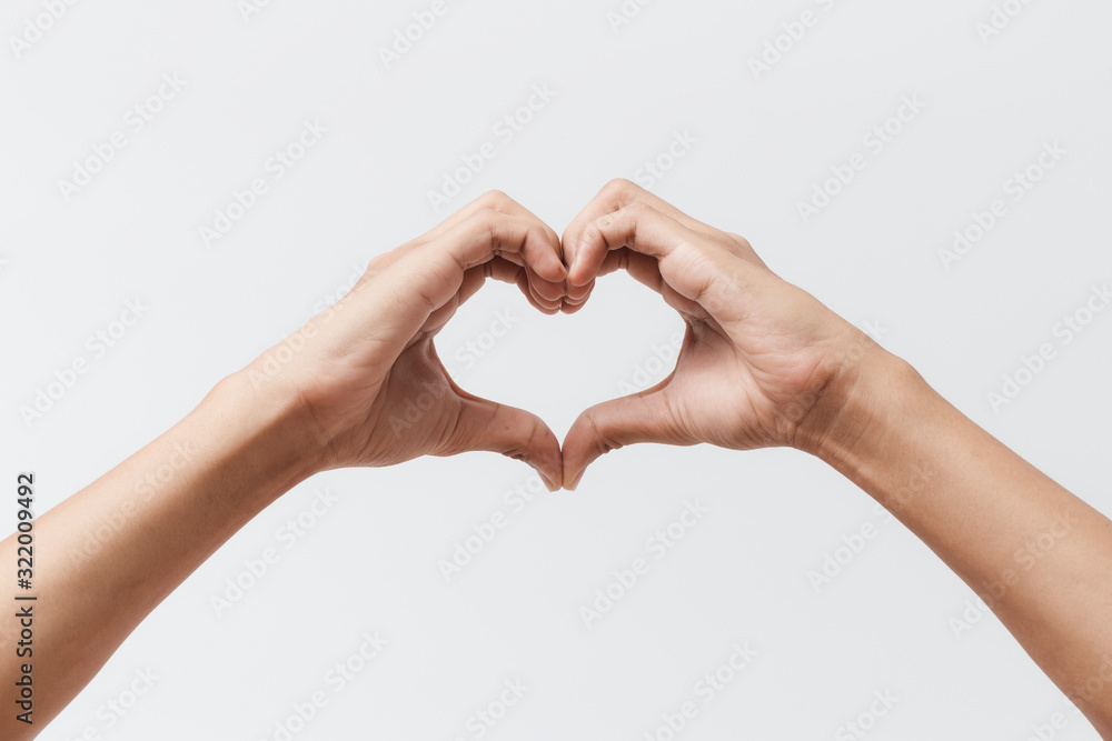 Man hands making a heart shape on a white isolated background - obrazy, fototapety, plakaty 