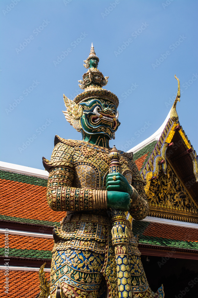 The giant in Wat Phra Kaew that is the most sacred Buddhist temple in Bangkok Thailand.