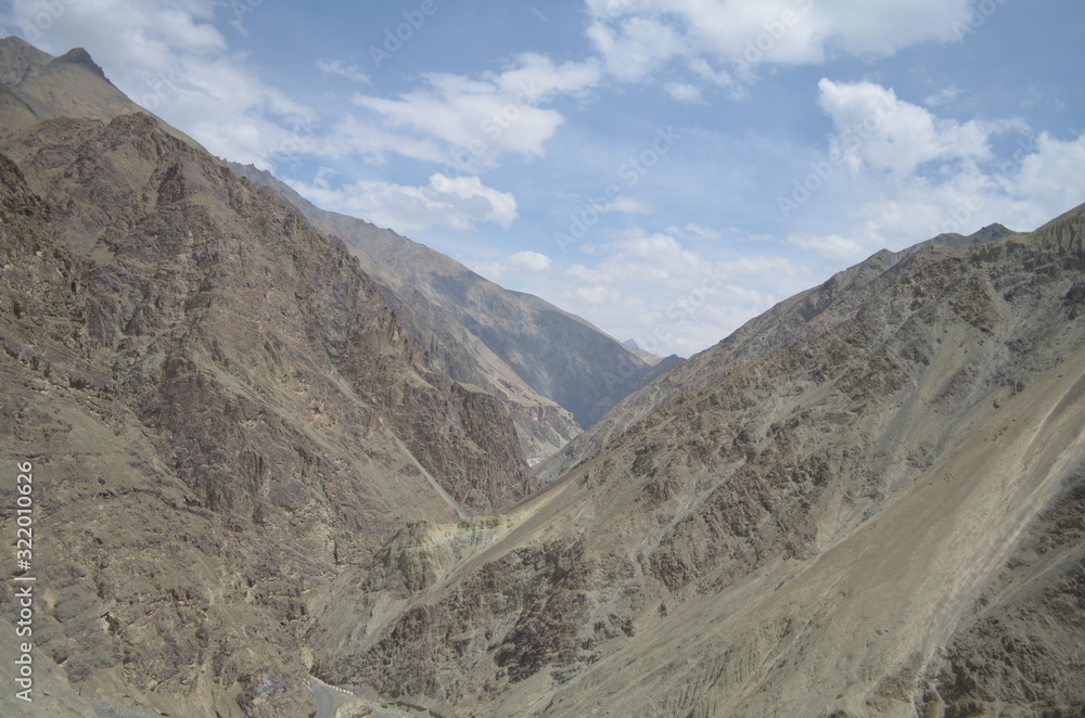 the view of Himalaya mountains on a sunny day under the blue sky in the morning or the evening in Tibet India China the road on high altitudes the view of Himalaya mountains on a sunny day under the blue sky in the morning or the evening in Tibet India China the road on high altitudes