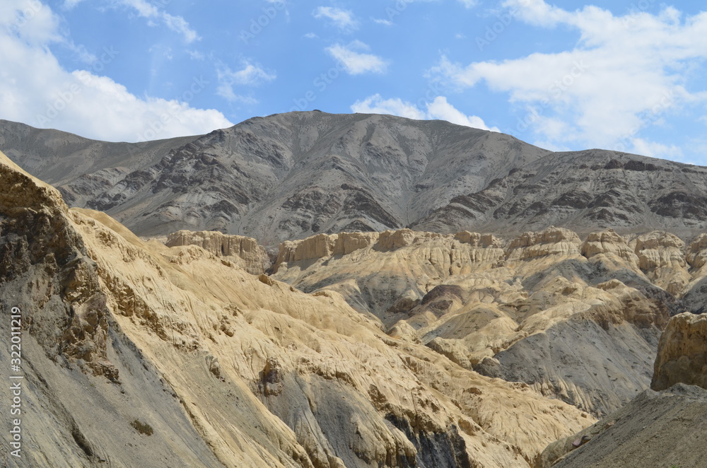 the view of Himalaya mountains on a sunny day under the blue sky in the morning or the evening in Tibet India China the road on high altitudes