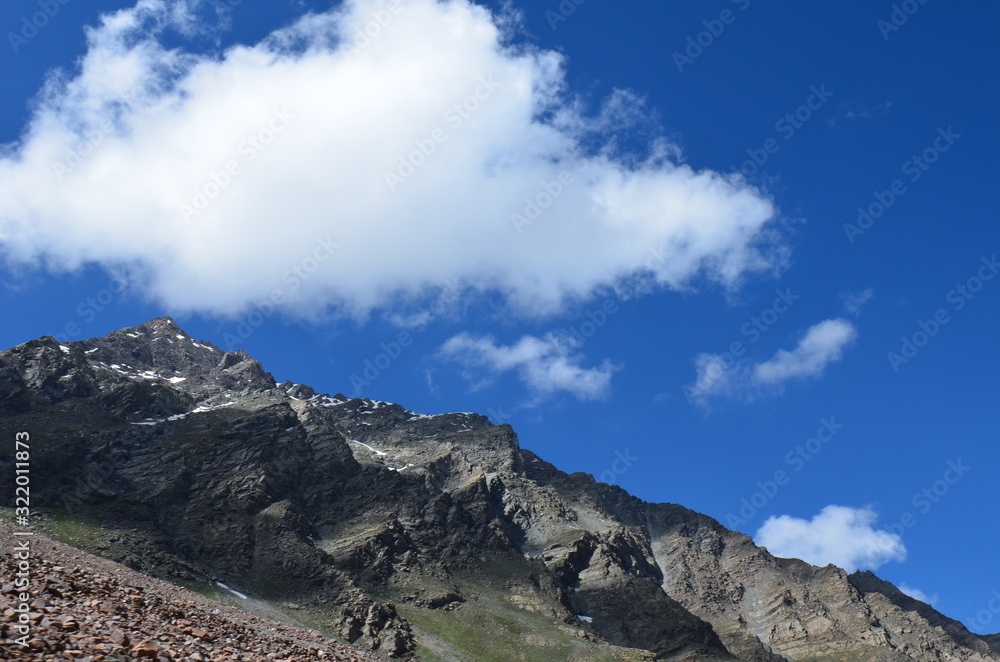 the view of Himalaya mountains on a sunny day under the blue sky in the morning or the evening in Tibet India China the road on high altitudes