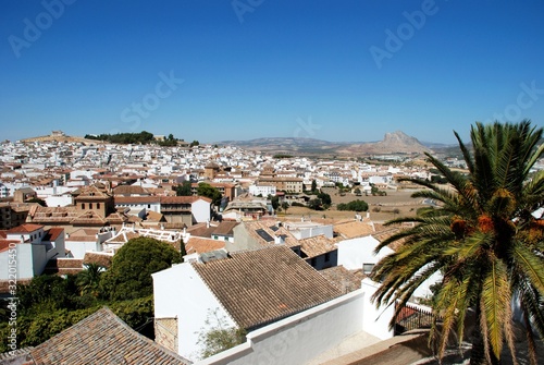 View over the town rooftops looking North West towards the Lovers Rock (Pena de los Enamorados), Antequera, Spain.