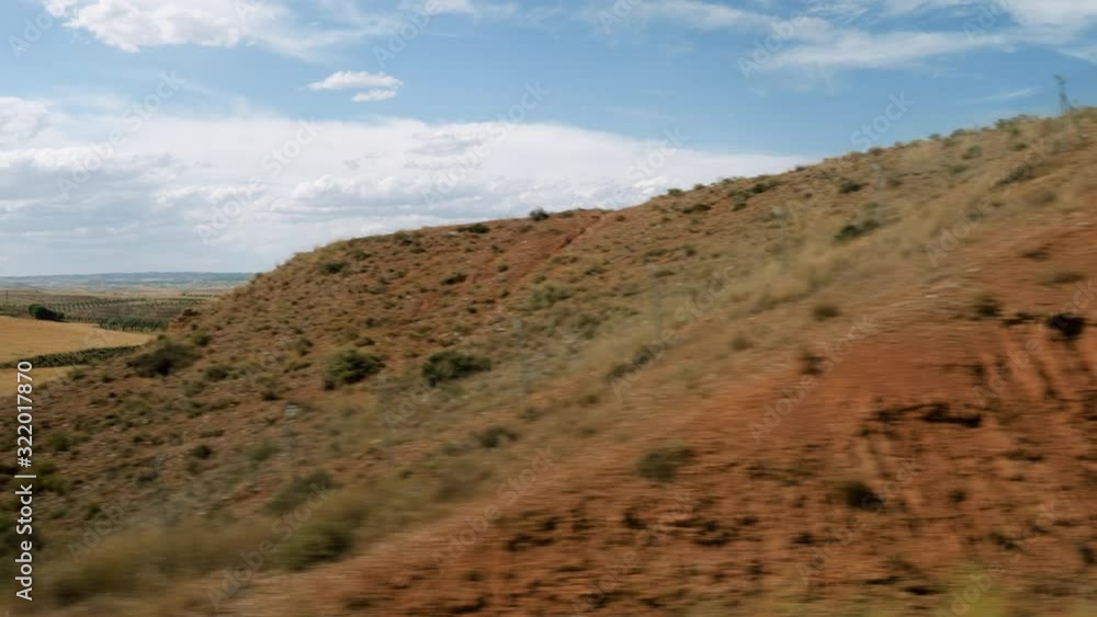 Scenic landscape of spanish mountains and olive grove. View from the window of high speed train riding through suburb of Spain. 4K Scenic landscape of spanish mountains and olive grove. View from the window of high speed train riding through suburb of Spain. 4K