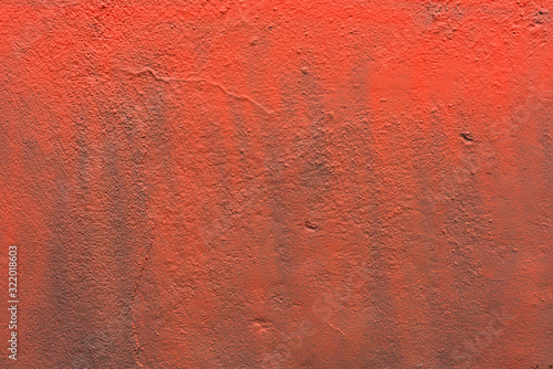 Red poorly painted concrete wall