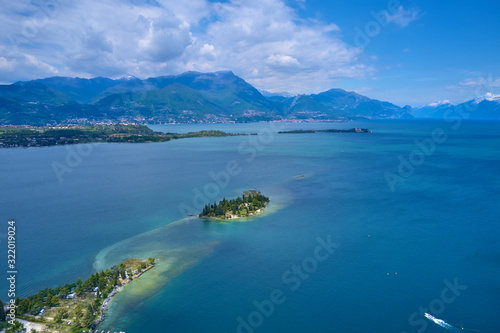 Panoramic view of the island of San Biagio, Italy. Lake Garda, blue sky 