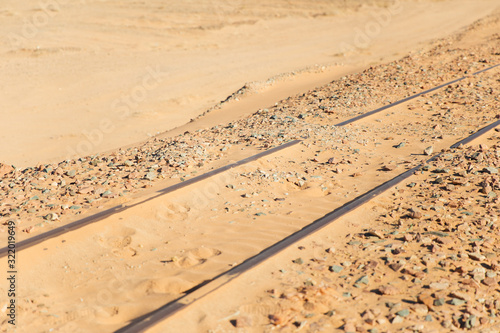 Metal rails buried in the sand. Jordan, Wadi RAM desert.