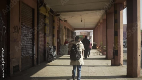 Wallpaper Mural day shot of young female walking and exploring Marrakesh Moroccan city adventure lifestyle , Torontodigital.ca