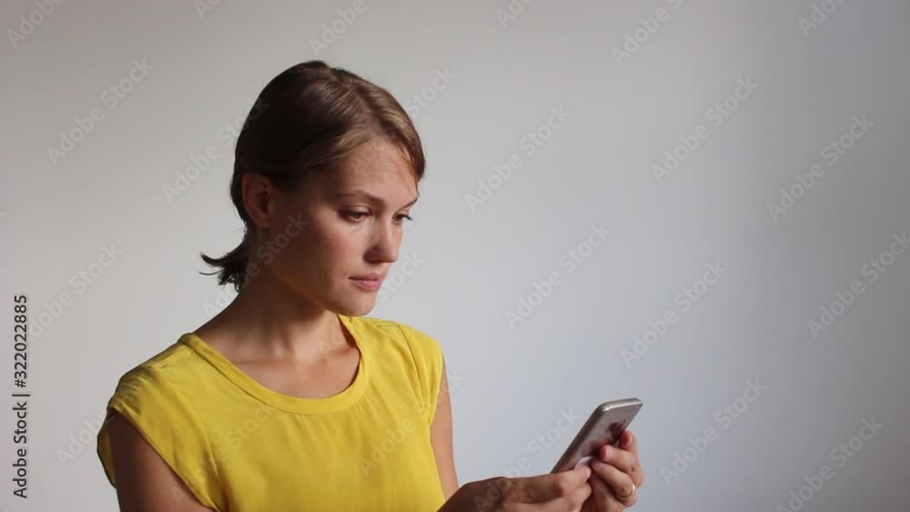 woman using a smartphone on white background woman using a smartphone on white background