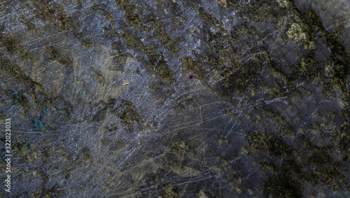 Texture of wet stone covered with moss. Background image of macro photography texture stone
